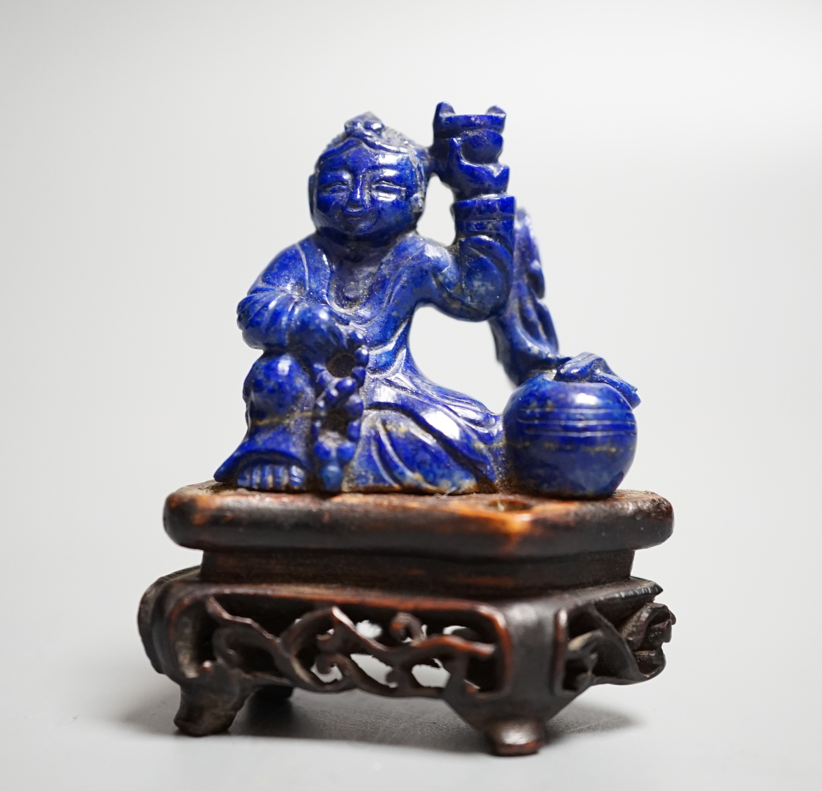 A Chinese carved lapis lazuli model of a Buddha, height 5.5cm (a.f.)